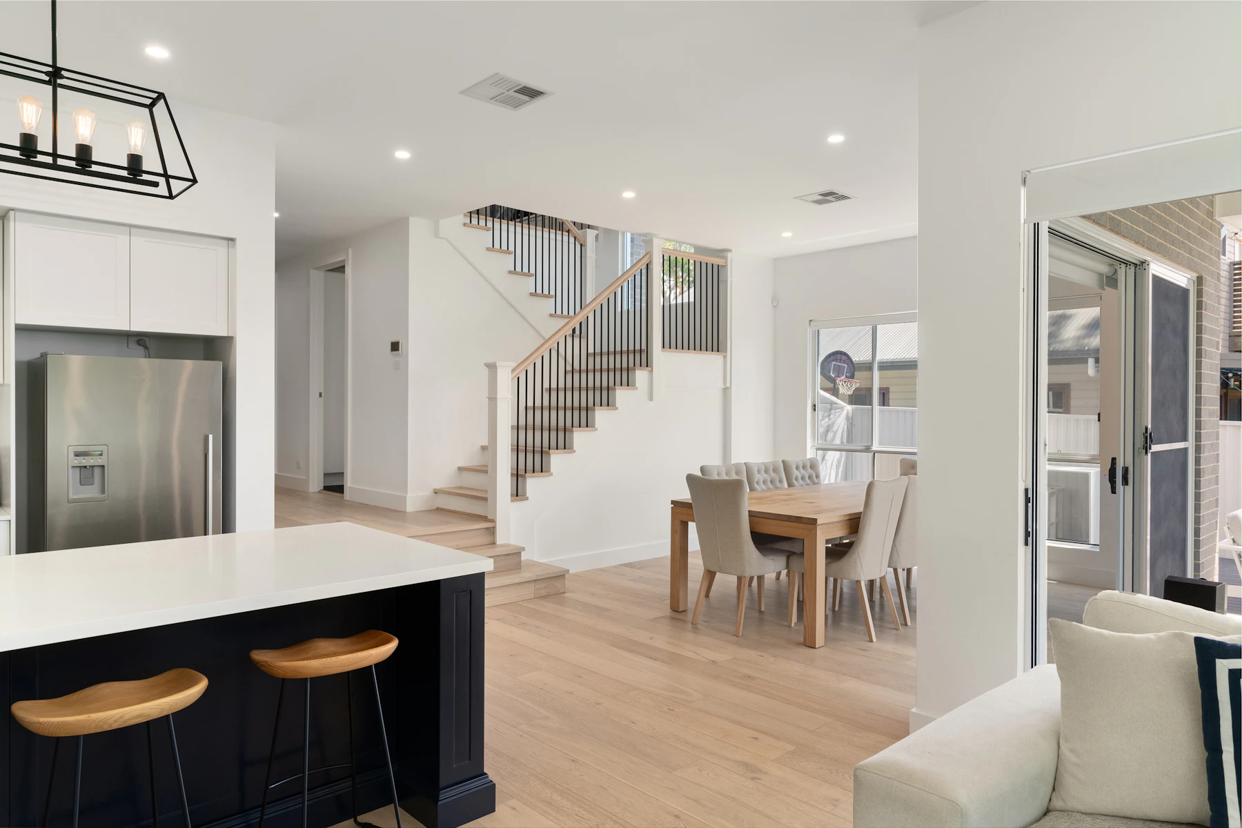 A bright home with an open kitchen, dining space and living area
